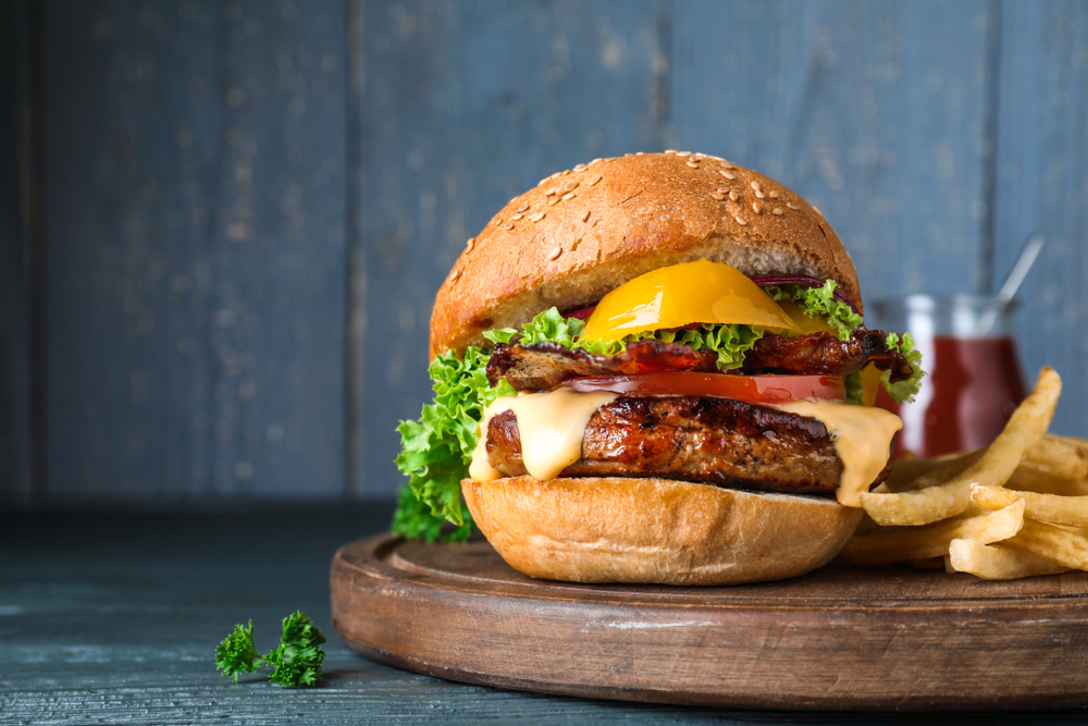 Fresh,juicy,bacon,burger,on,grey,table.,space,for,text