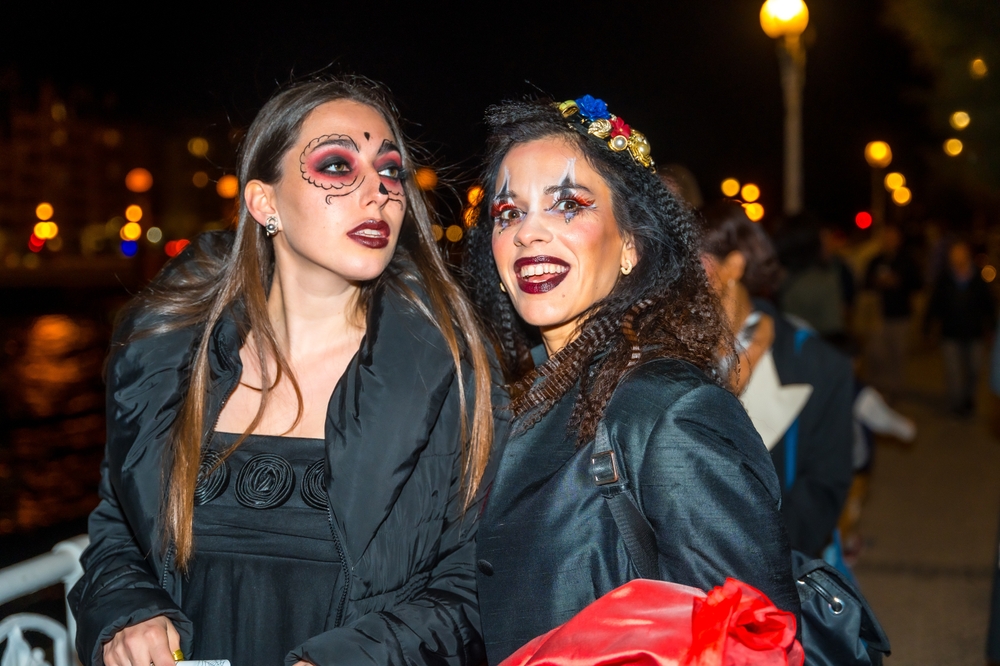 Two,women,are,dressed,up,in,halloween,costumes,and,are